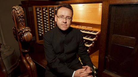 David Briggs sitting at organ